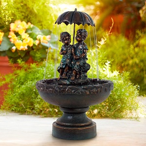 Boy and Girl Under Umbrella Fountain